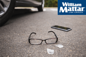 broken glasses and phone belonging to pedestrian