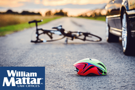 bicycle and bike helmet in the road after a car accident