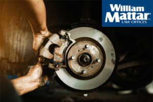 mechanic fixing defective brakes