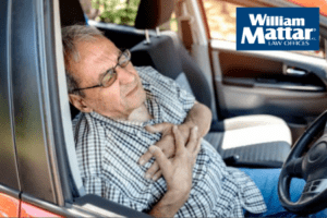 Elderly Gentleman Having Medical Emergency Behind Wheel of Vehicle
