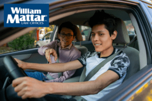 teen and his parent driving