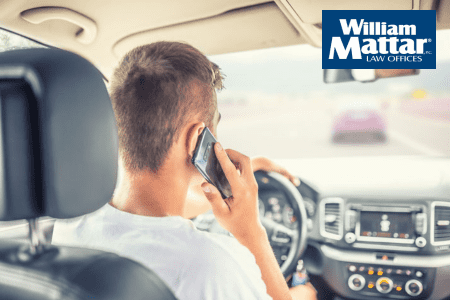 man using cellphone while driving